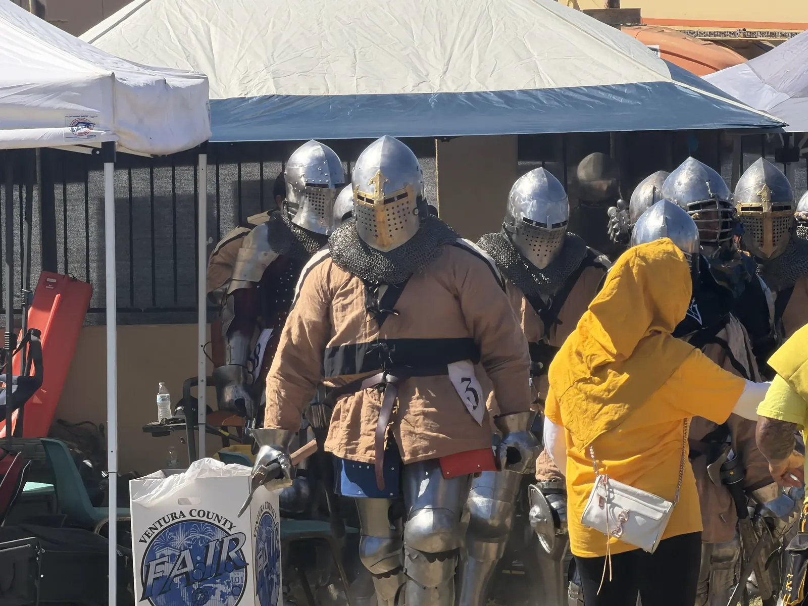 Knights in steel helmets and chain mail lining up for the War in the West medieval combat at Oktoberfest, Ventura County Fairgrounds